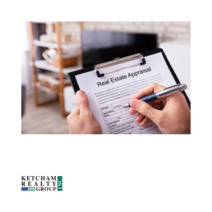 A person filling out a real estate appraisal form on a clipboard, with a home interior in the background. The Ketcham Realty Group logo is displayed in the lower-left corner.